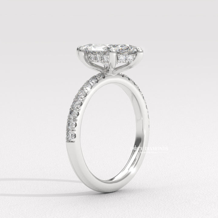 Angled view of marquise cut diamond in pave setting