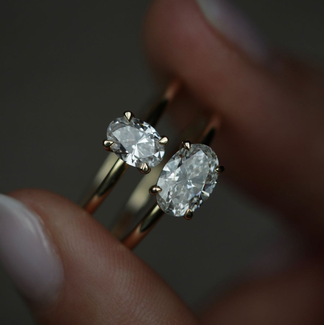 Oval solitaire engagement ring viewed from the side
