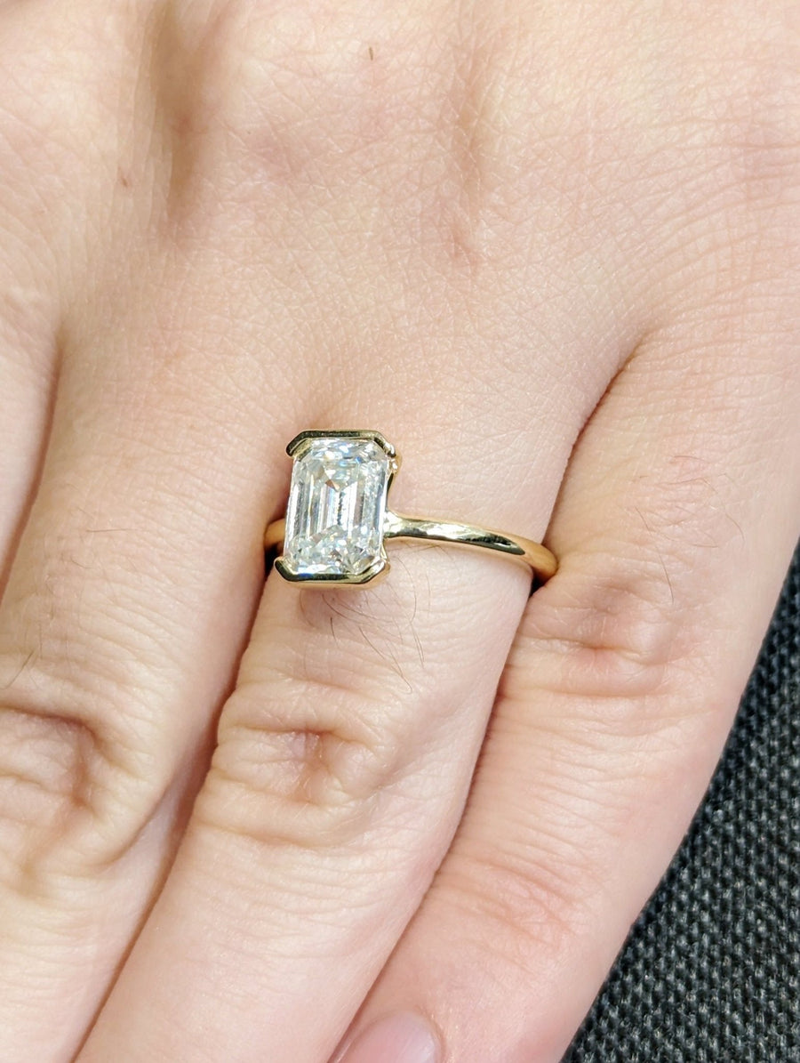 1.50CT emerald cut bezel engagement ring available to buy now