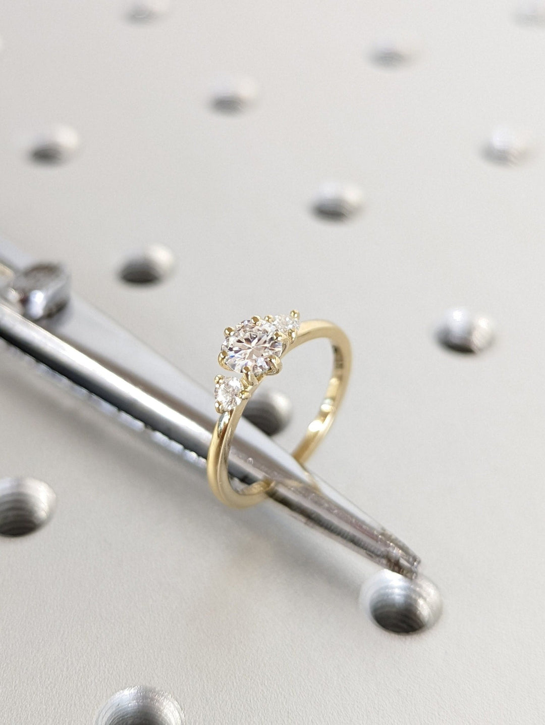 Round solitaire engagement ring close-up highlighting diamond sparkle
