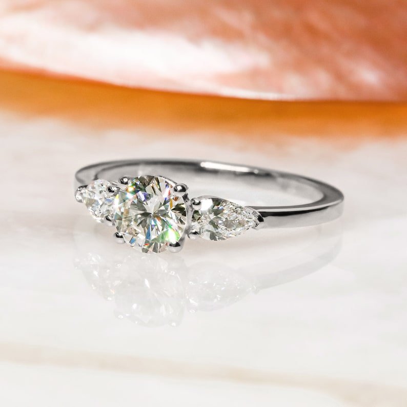 Round three stone engagement ring with certified lab grown diamond