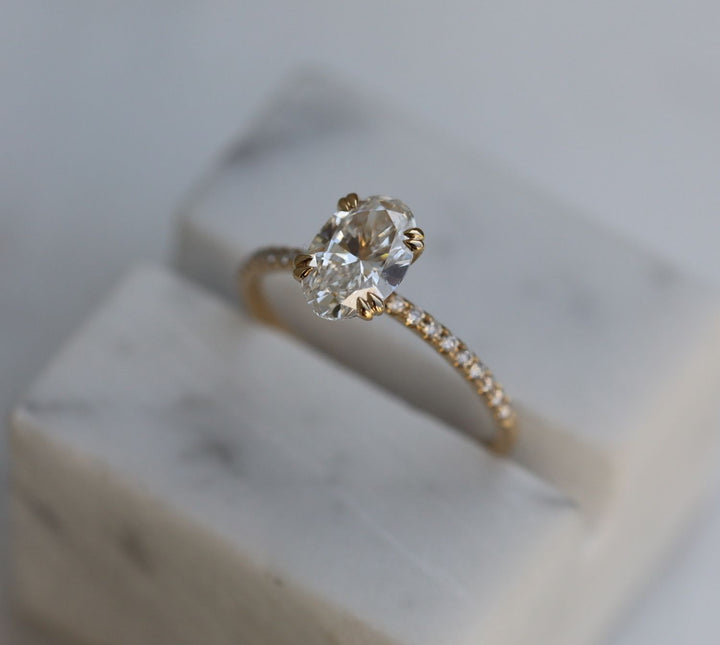 Oval cut engagement ring side view showing band detail