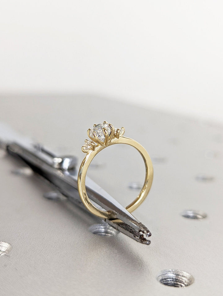 Macro shot of round cut diamond facets in solitaire ring setting