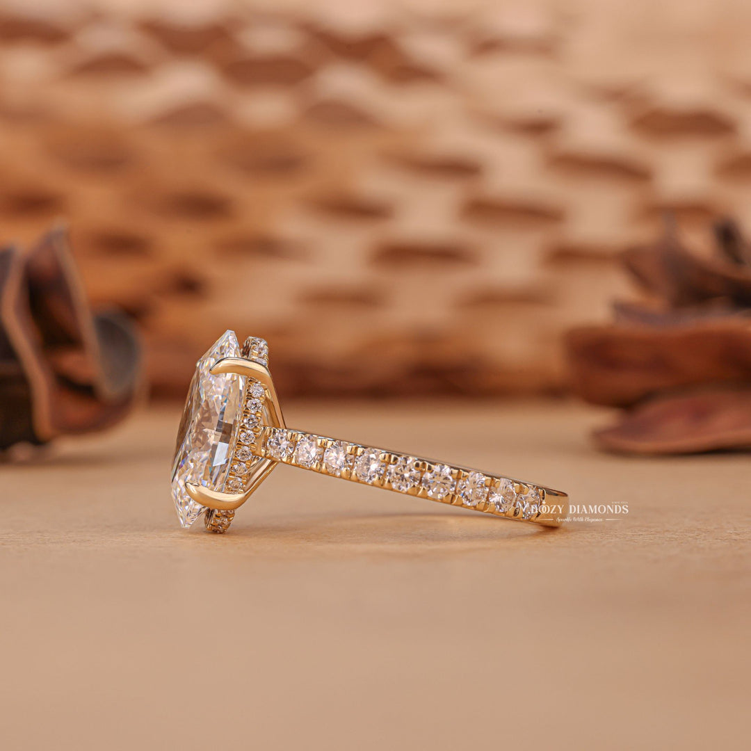 Profile view of oval cut hidden halo engagement ring band