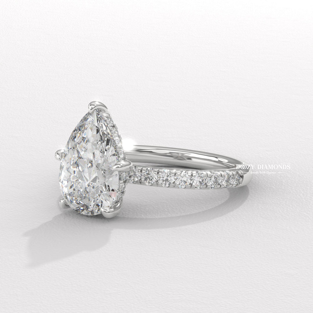 Pear cut engagement ring side view showing band detail