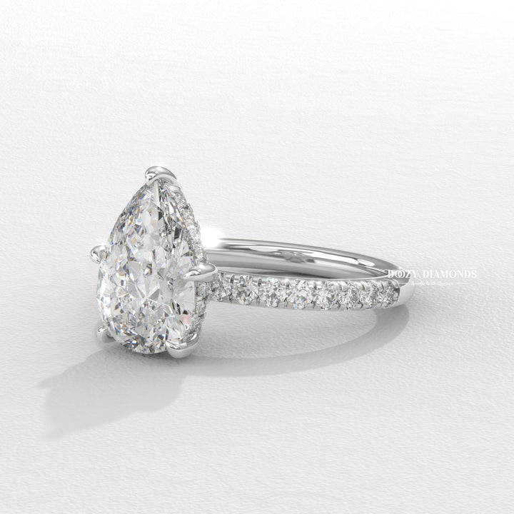 Pear cut engagement ring side view showing band detail