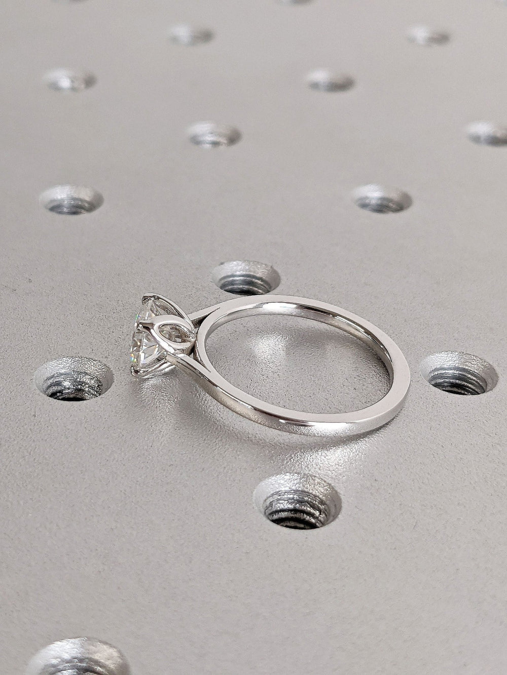Round solitaire engagement ring close-up showing high clarity diamond clarity