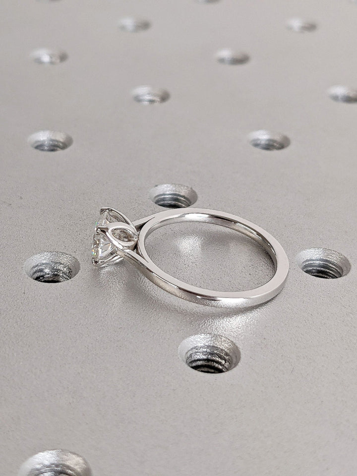 Round solitaire engagement ring close-up showing high clarity diamond clarity