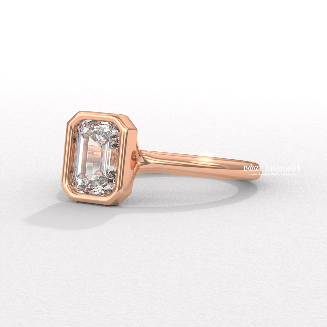 Emerald cut bezel engagement ring shown in real-life wear