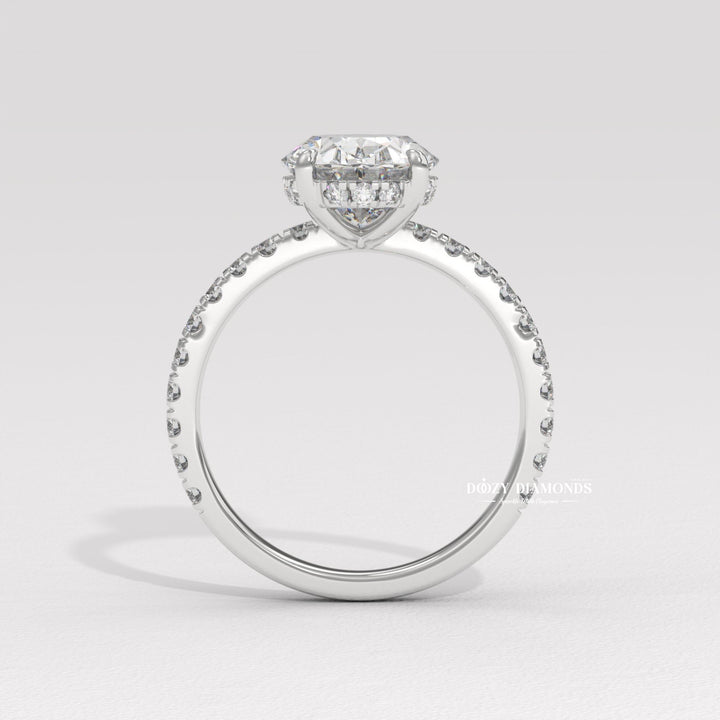 Profile view of oval cut hidden halo engagement ring band