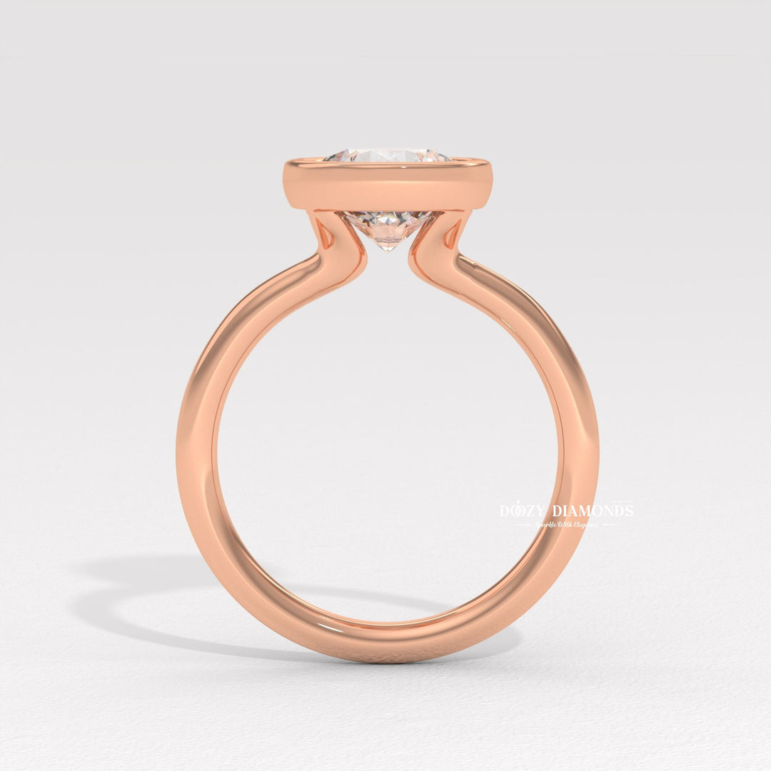 Round bezel diamond engagement ring available in multiple metals