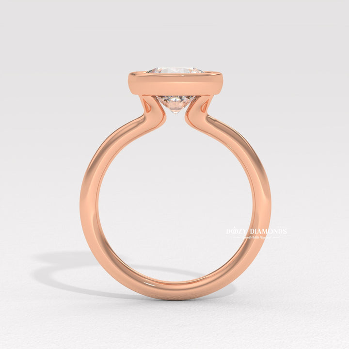 Round bezel diamond engagement ring available in multiple metals