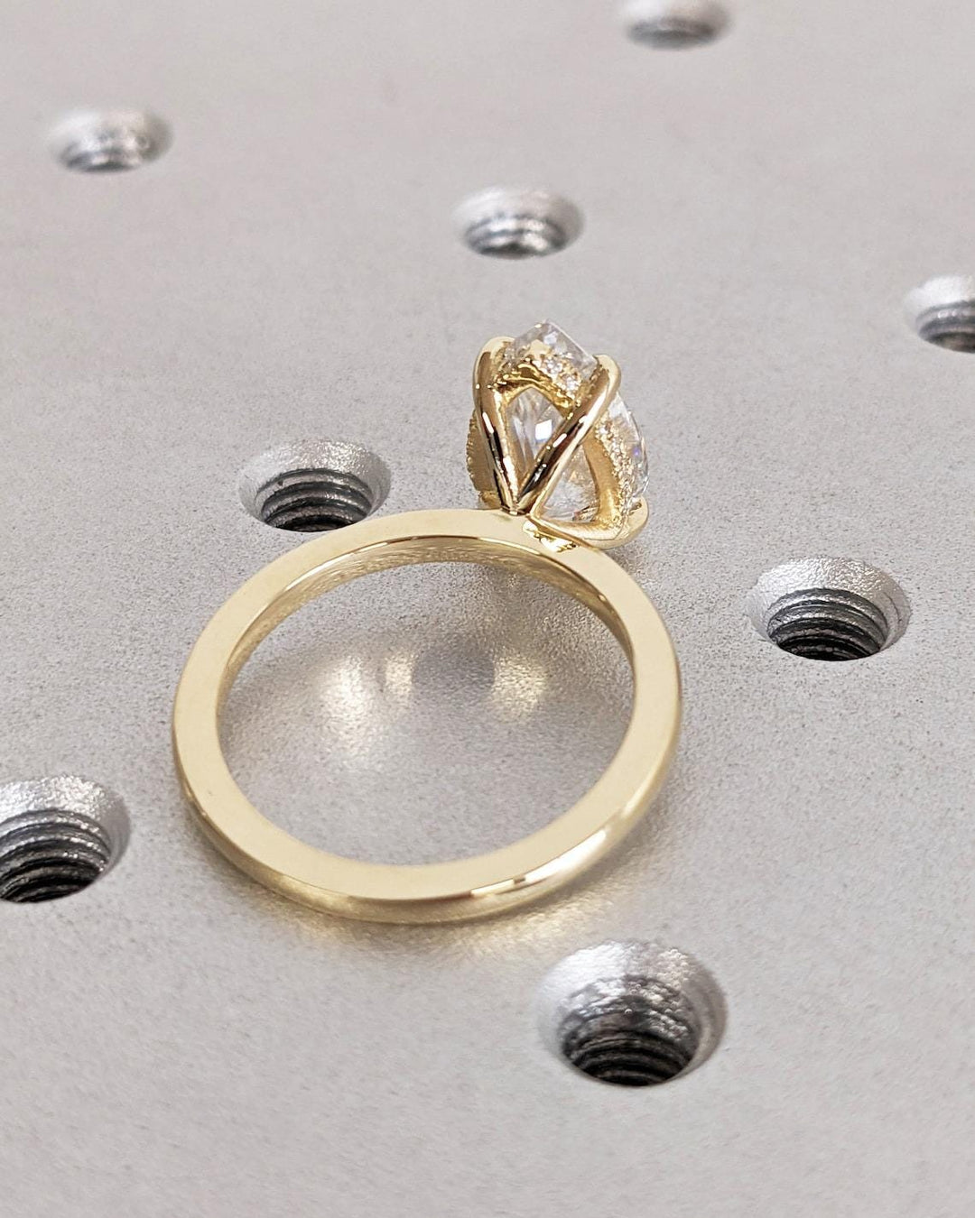 Pear hidden halo ring set with an IGI graded diamond