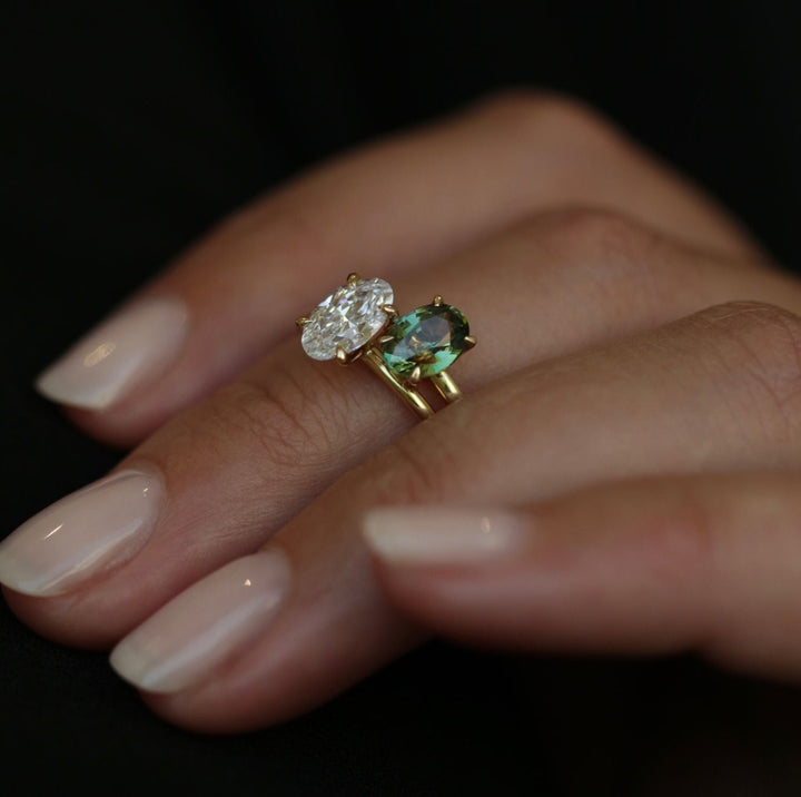 Detailed close-up of oval solitaire diamond engagement ring