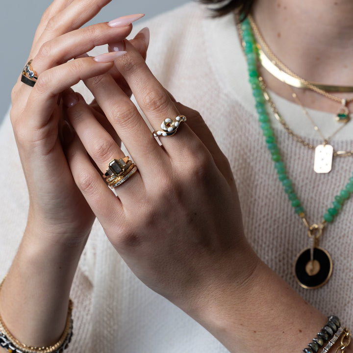 Emerald cut engagement ring side view showing band detail