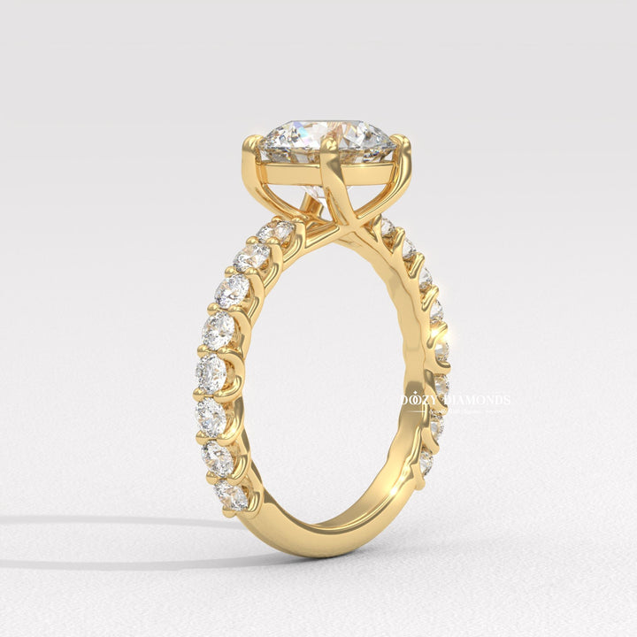 Round solitaire engagement ring shown on hand for true-to-life sizing