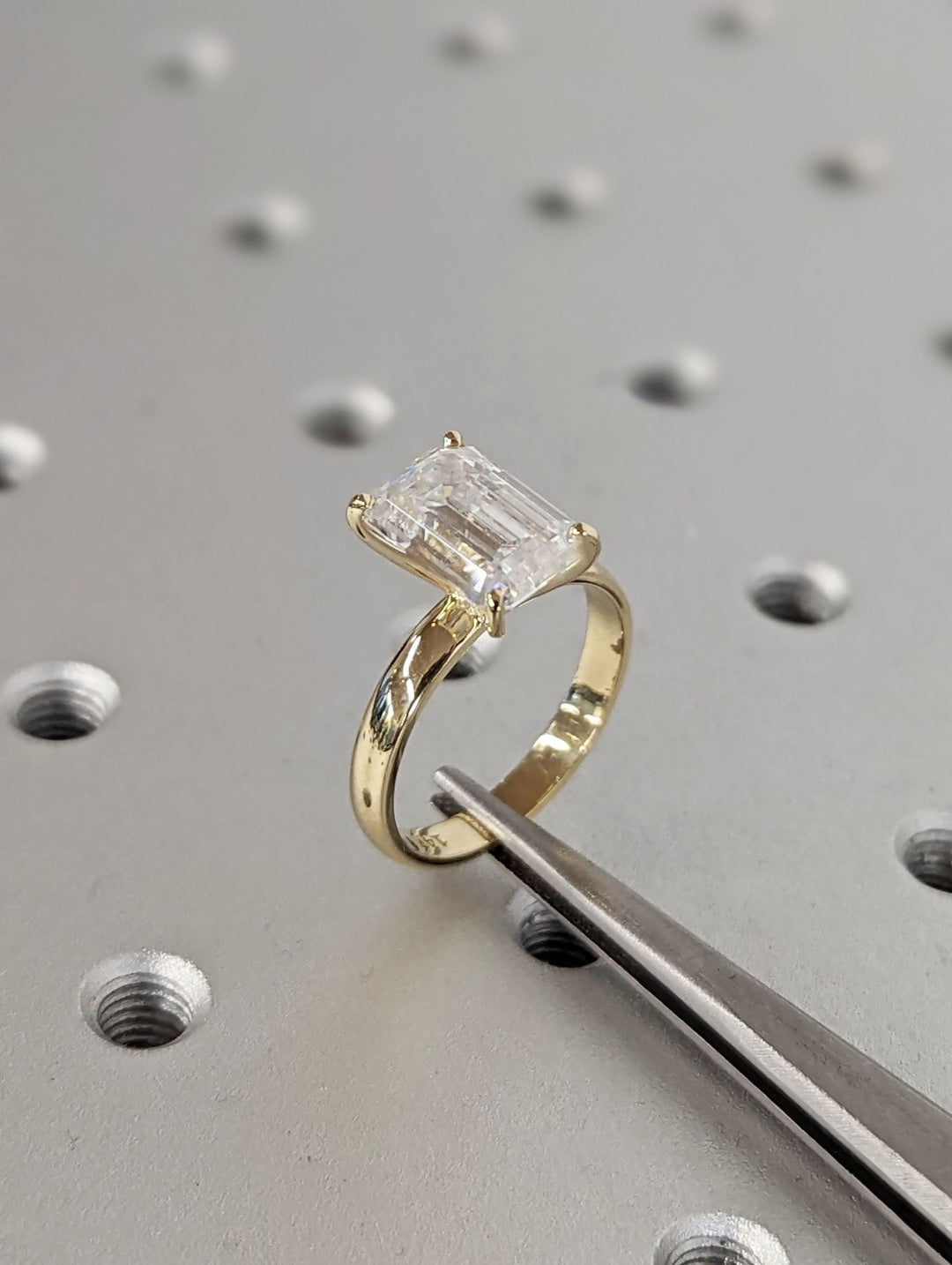 Emerald solitaire lab grown diamond ring side profile in gold setting