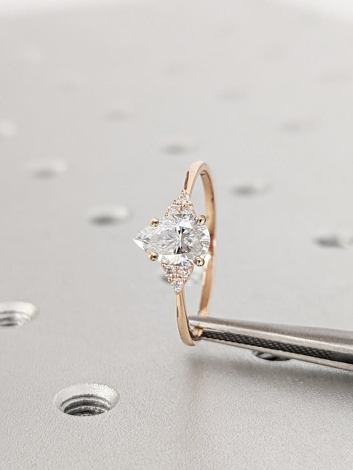 Pear cluster lab grown diamond ring fitted on finger