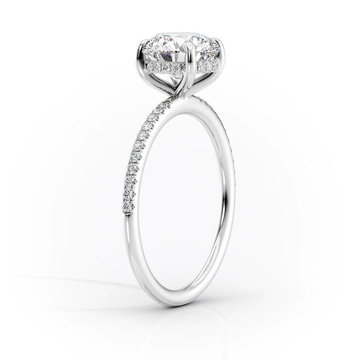 Detailed close-up of oval hidden halo diamond engagement ring