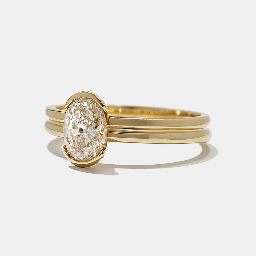 Oval bezel diamond ring presented in signature gift packaging
