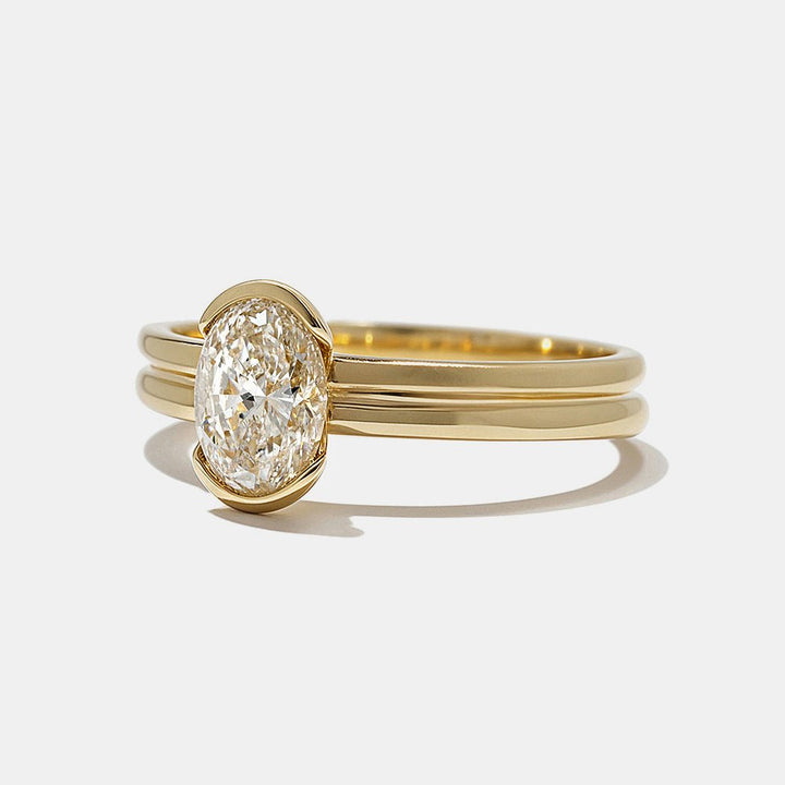 Oval bezel diamond ring presented in signature gift packaging