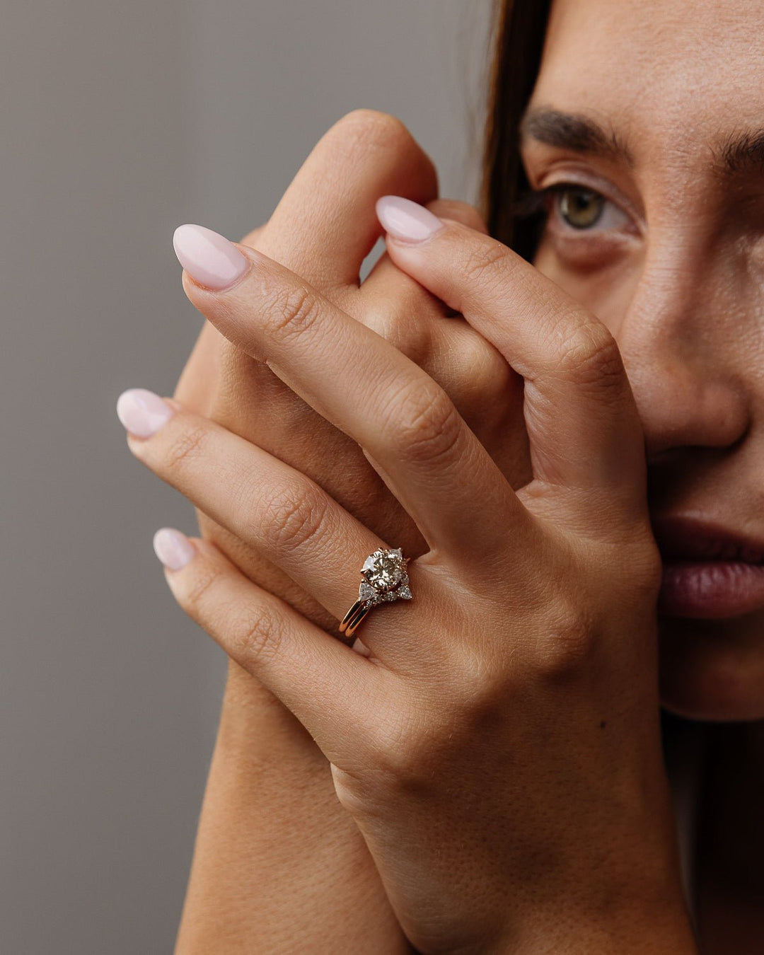 Top-down view of round cut three stone engagement ring