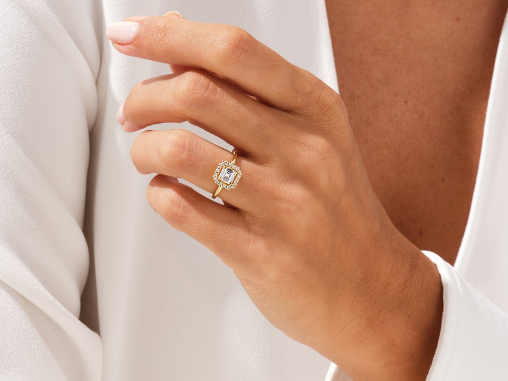 Unboxing view of asscher cut halo diamond engagement ring