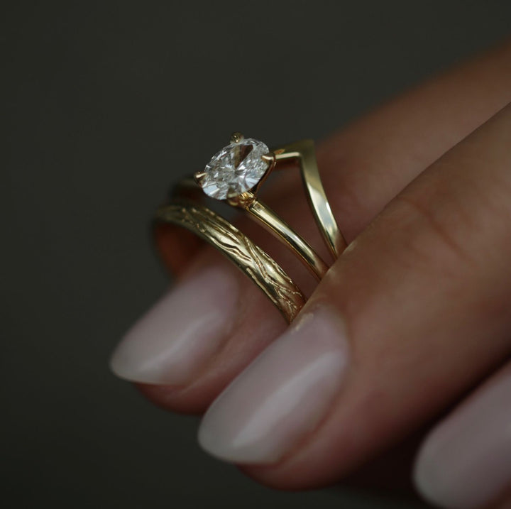 Oval cut engagement ring side view showing band detail