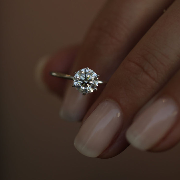 Fine craftsmanship detail on round solitaire engagement ring