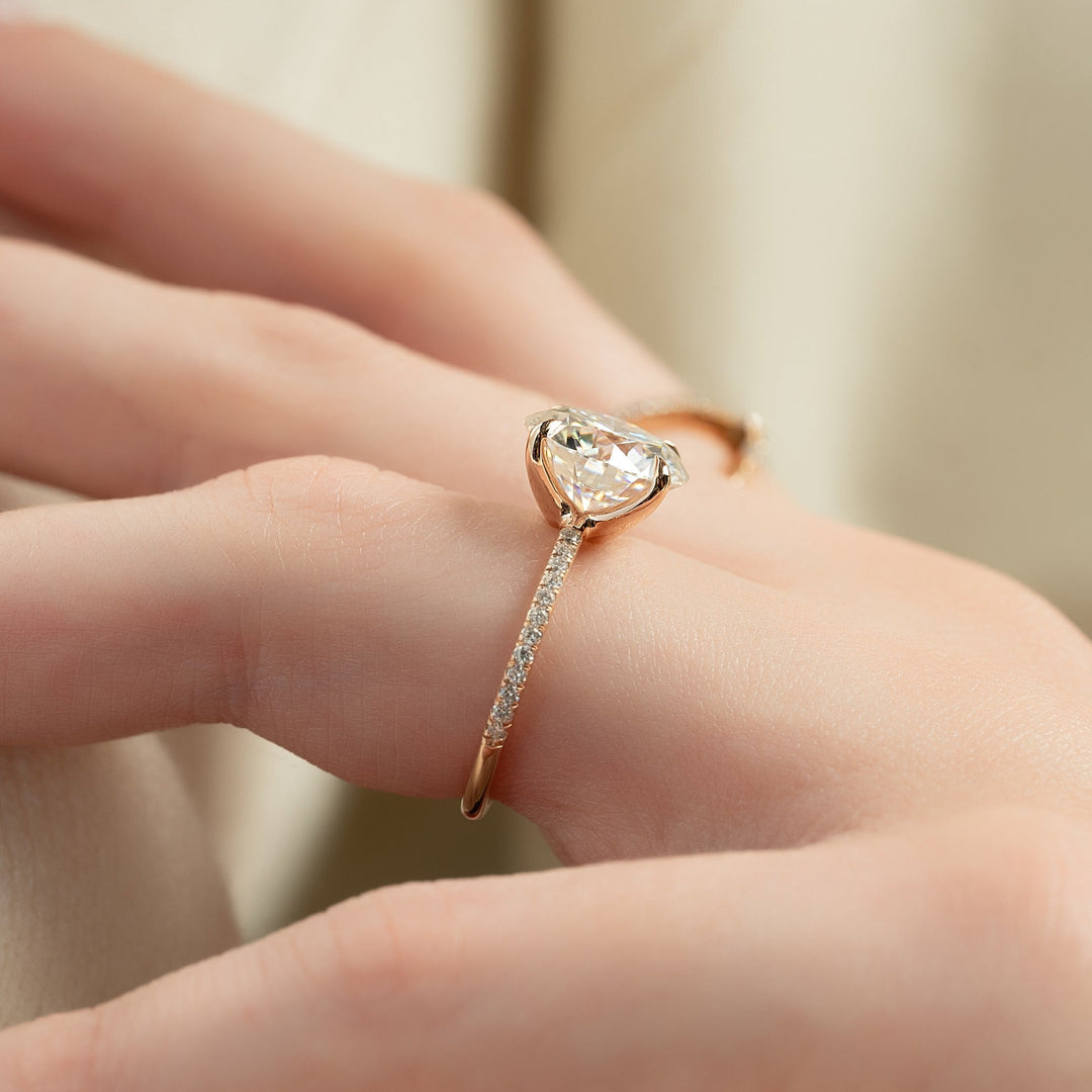 Round pave engagement ring offered in gold and platinum