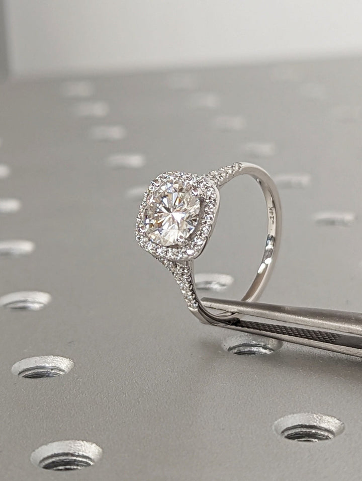 Round pave diamond ring presented in signature gift packaging