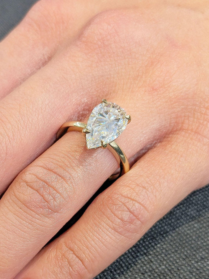 Pear hidden halo lab grown diamond ring in jewelry gift box