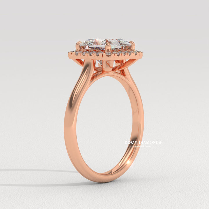 Close-up of princess cut center diamond in solitaire engagement ring