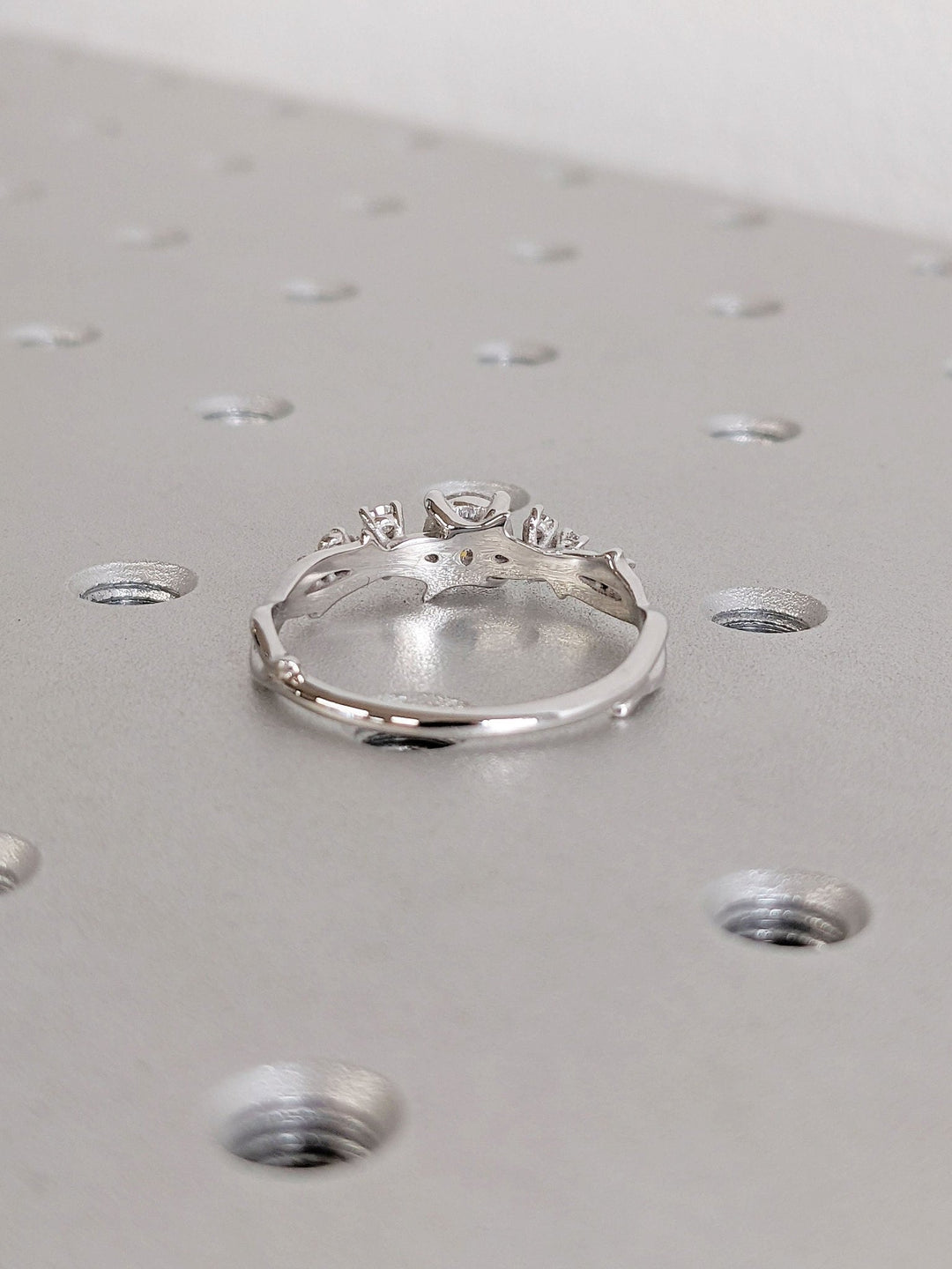Lifestyle shot of round cluster diamond ring on hand