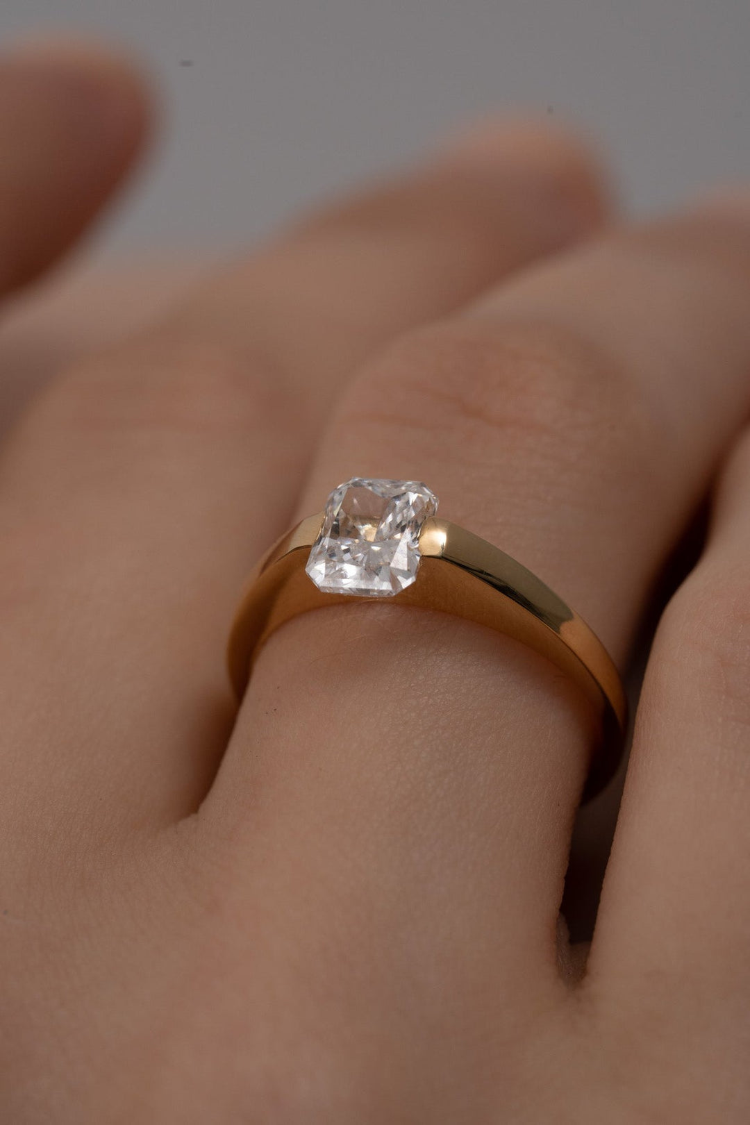 Premium radiant cut solitaire engagement ring crafted in solid gold