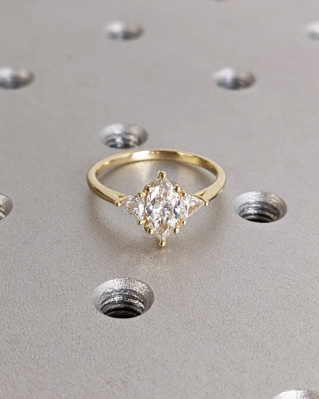 Close-up of marquise cut center diamond in solitaire engagement ring