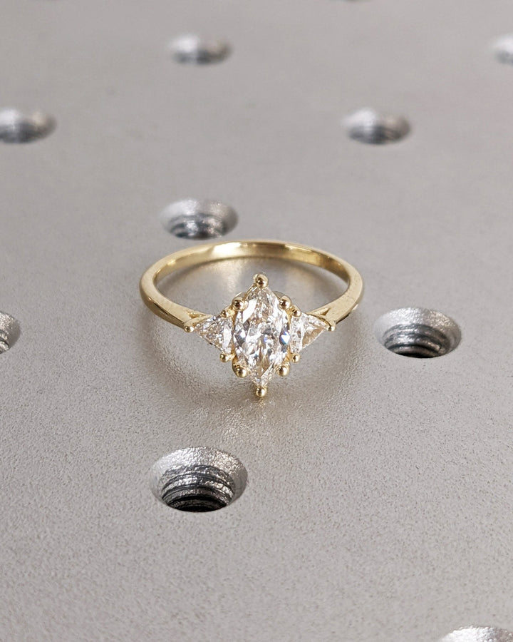 Close-up of marquise cut center diamond in solitaire engagement ring