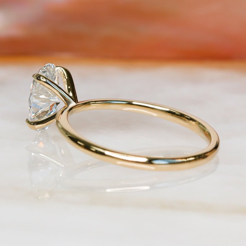 Macro shot of oval cut diamond facets in solitaire ring setting