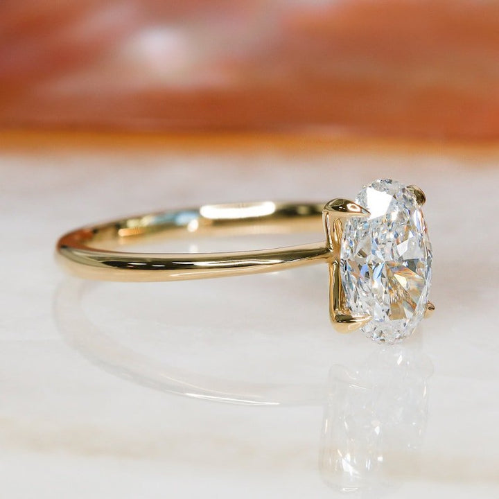 Close-up of oval cut center diamond in solitaire engagement ring