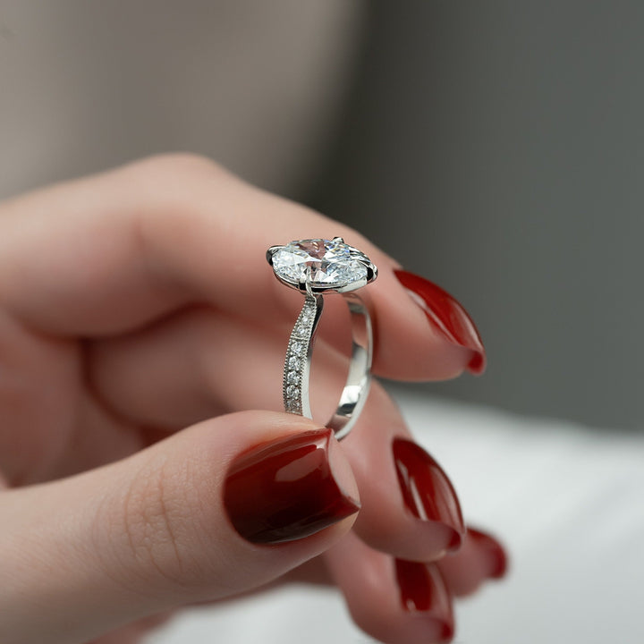 Oval hidden halo engagement ring with certified lab grown diamond