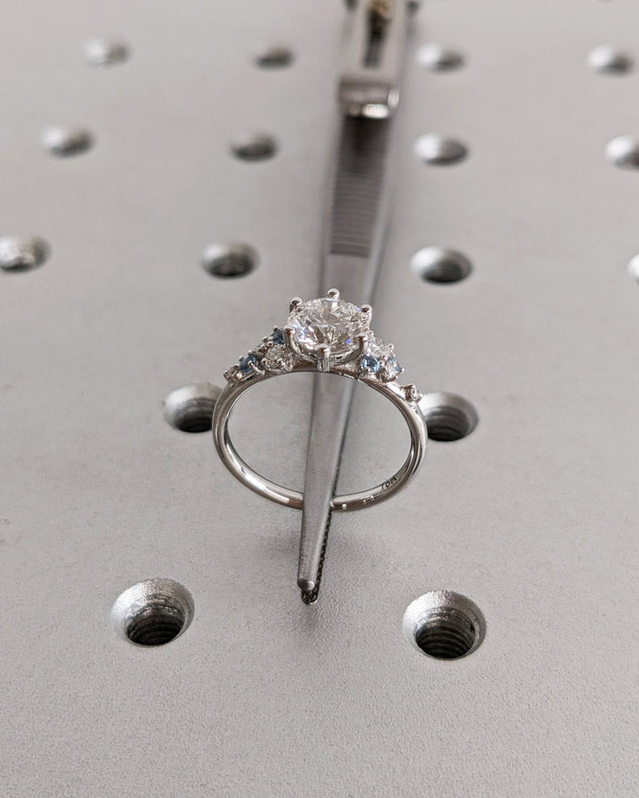 Round cut engagement ring side view showing band detail