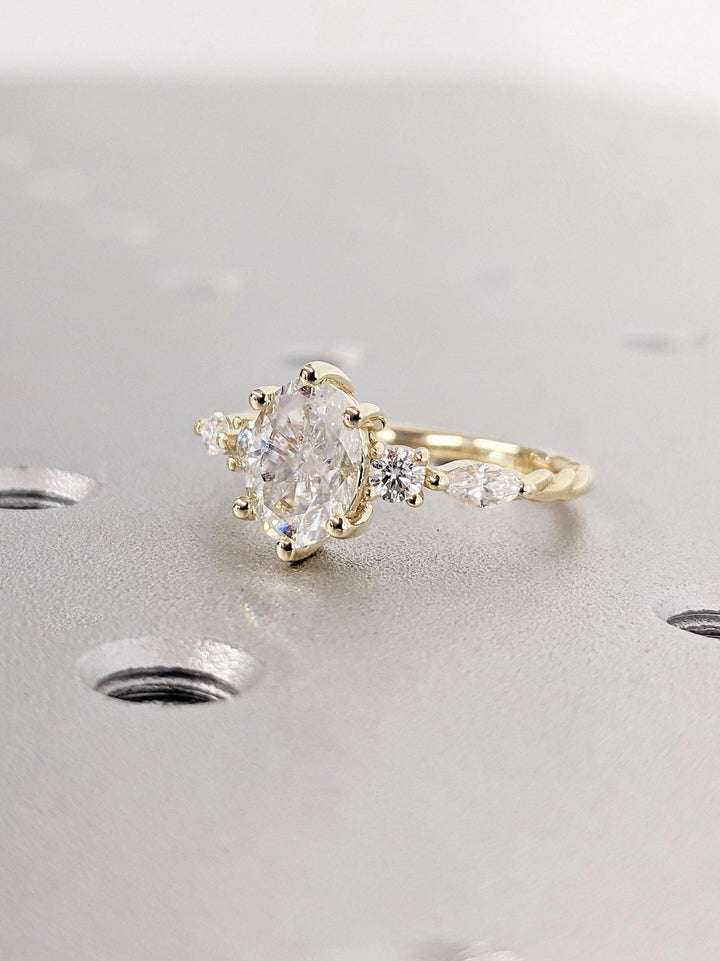 Oval cluster engagement ring close-up showing high clarity diamond clarity