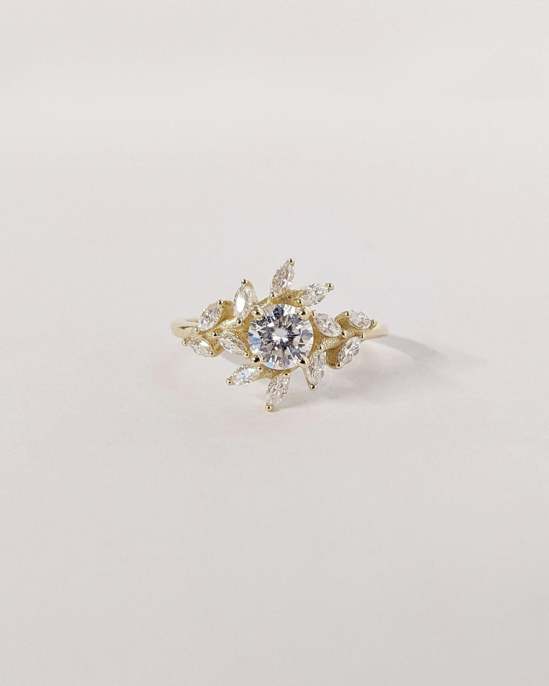 Round cut cluster engagement ring with IGI certified center diamond