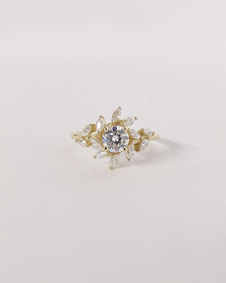 Round cut cluster engagement ring with IGI certified center diamond