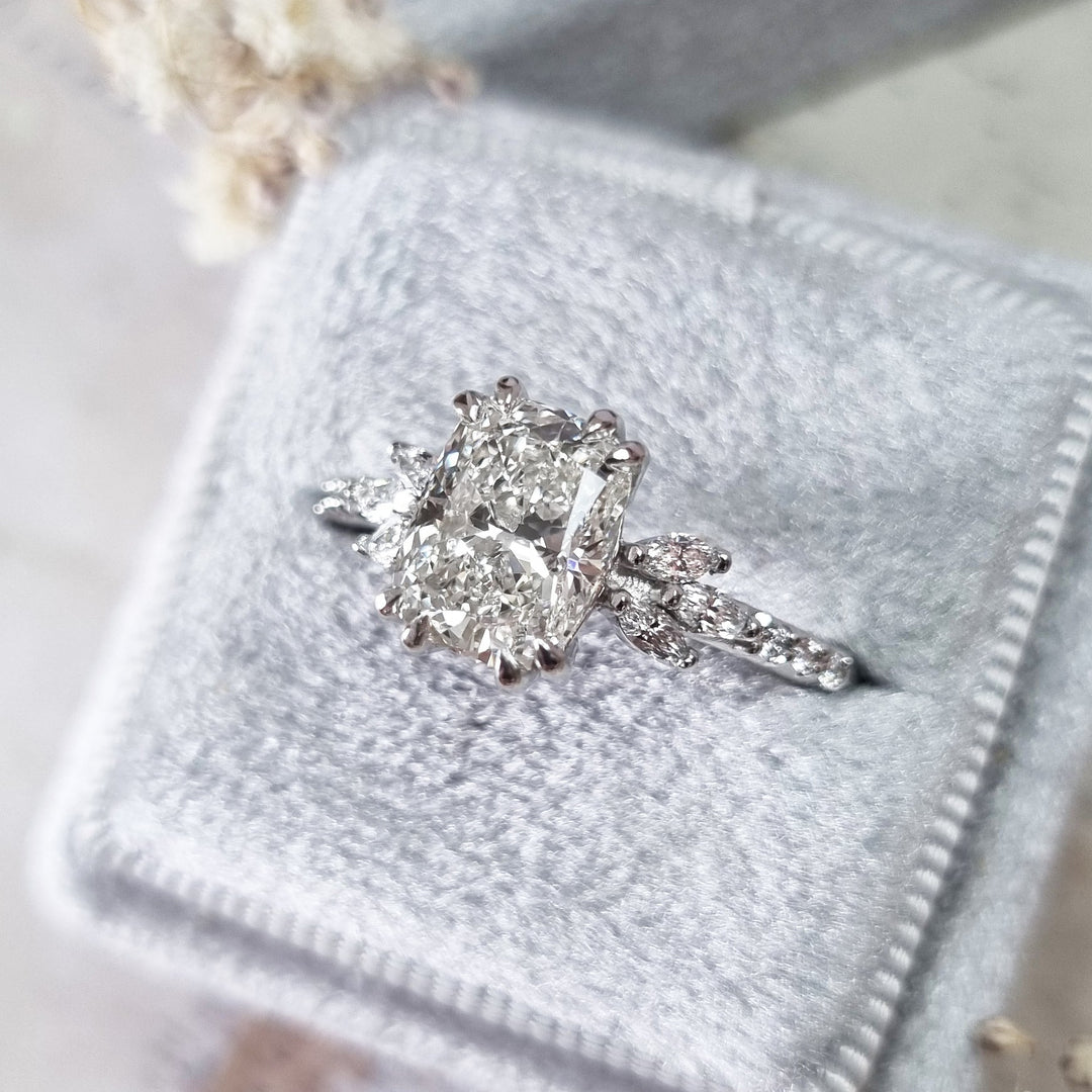 Side angle of cushion cluster diamond engagement ring