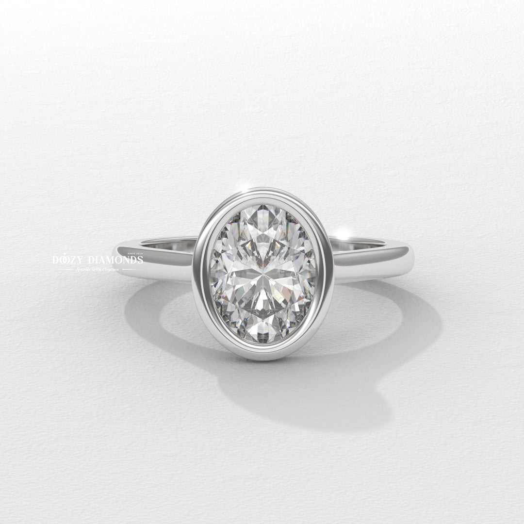 Detailed close-up of oval bezel diamond engagement ring