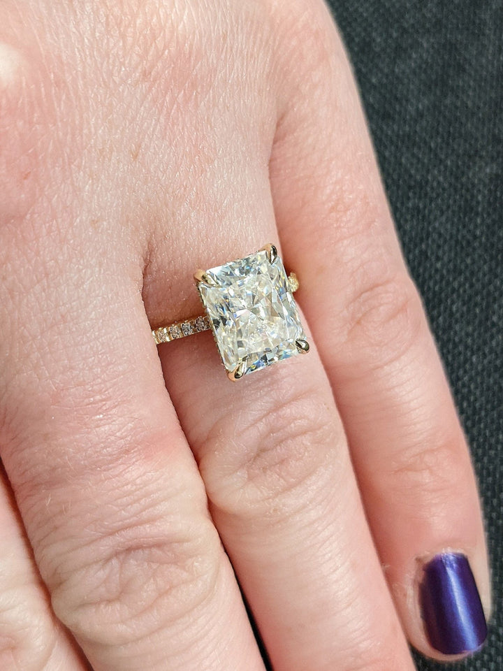 Radiant cut diamond ring worn on hand