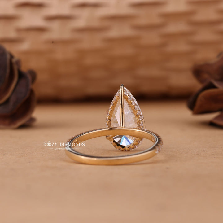 Pear cut engagement ring side view showing band detail