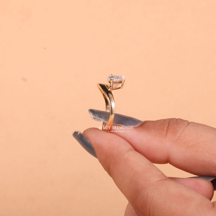 Pear east west lab grown diamond ring fitted on finger