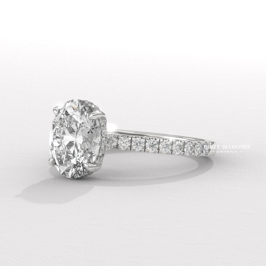 Profile view of oval cut hidden halo engagement ring band